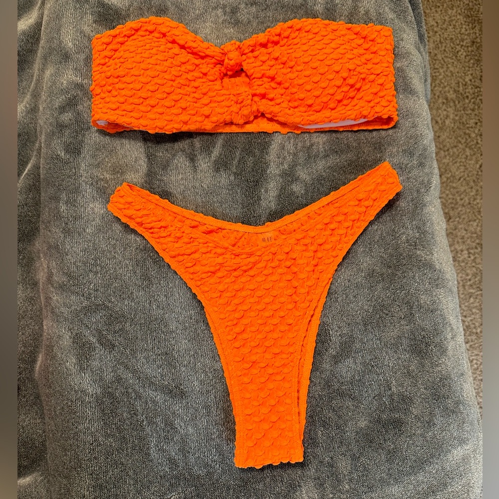 Super fun Neon Orange strapless bikini.  Size medium.  Never worn.